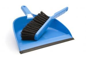 A broom and dustpan in a very clean background