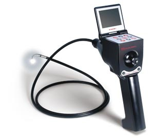 A handheld device with a joystick thumb control with a tube extending off of the front