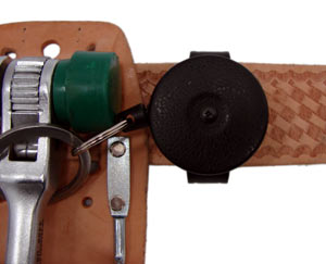 A retractor with a leather loop is connected to a deluxe scaffold wrench