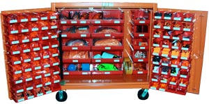 A wide rolling cabinet stocked with a large amount of FME supplies