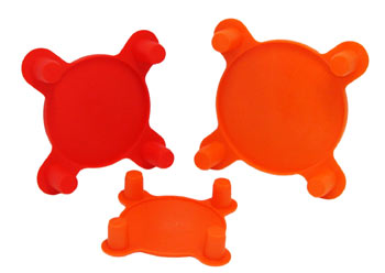 Orange and red plastic caps with four knobs for insertion in flange bolt holes