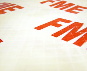 A closeup of a durble white material with FME text printed in intervals on the surface