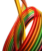 A group of various colored tubing curving around the white background