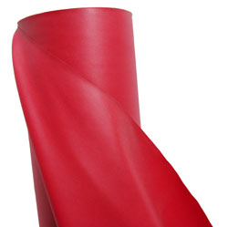 A roll of red fabric used for creating barriers