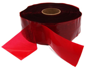 A roll of molecular tape has red film and red tape spread open