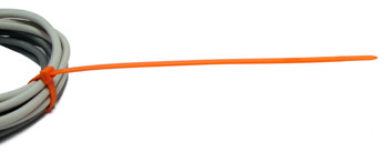 An orange nylon cable tie is wrapped around a bundle of wire