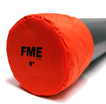 A six inch orange nylon bag style cover rests over the top of a pipe opening