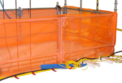 An orange net surrounds a cavity that is under foreign material exclusion controls