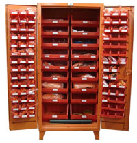 A tall orange cabinet stocked with a large variety of foreign material exclusion supplies