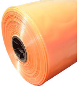 A side view of a roll of tinted plastic sheeting