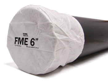 A six inch dissolvable white pipe cover rests tightly on the end of a six inch pipe